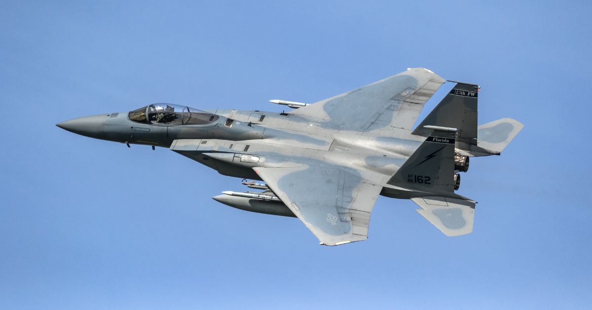 An F-15 flies in this stock image.