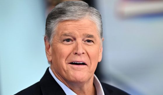 Sean Hannity listens during a taping of "Hannity" at Fox News Channel Studios in New York on Sept. 13.