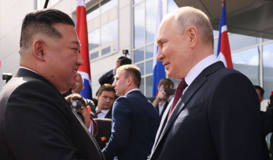 Russia's President Vladimir Putin, right, shakes hands with North Korea's leader Kim Jong Un during their meeting at the Vostochny Cosmodrome in Russia's Far East region September 13, 2023.