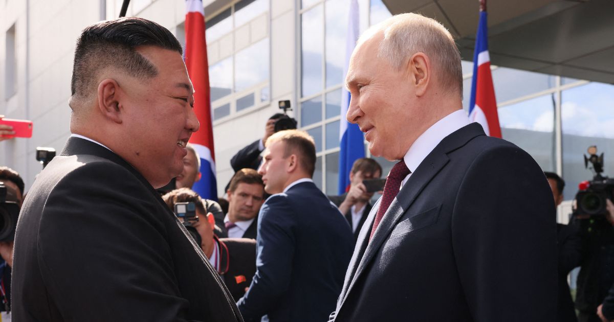 Russia's President Vladimir Putin, right, shakes hands with North Korea's leader Kim Jong Un during their meeting at the Vostochny Cosmodrome in Russia's Far East region September 13, 2023.