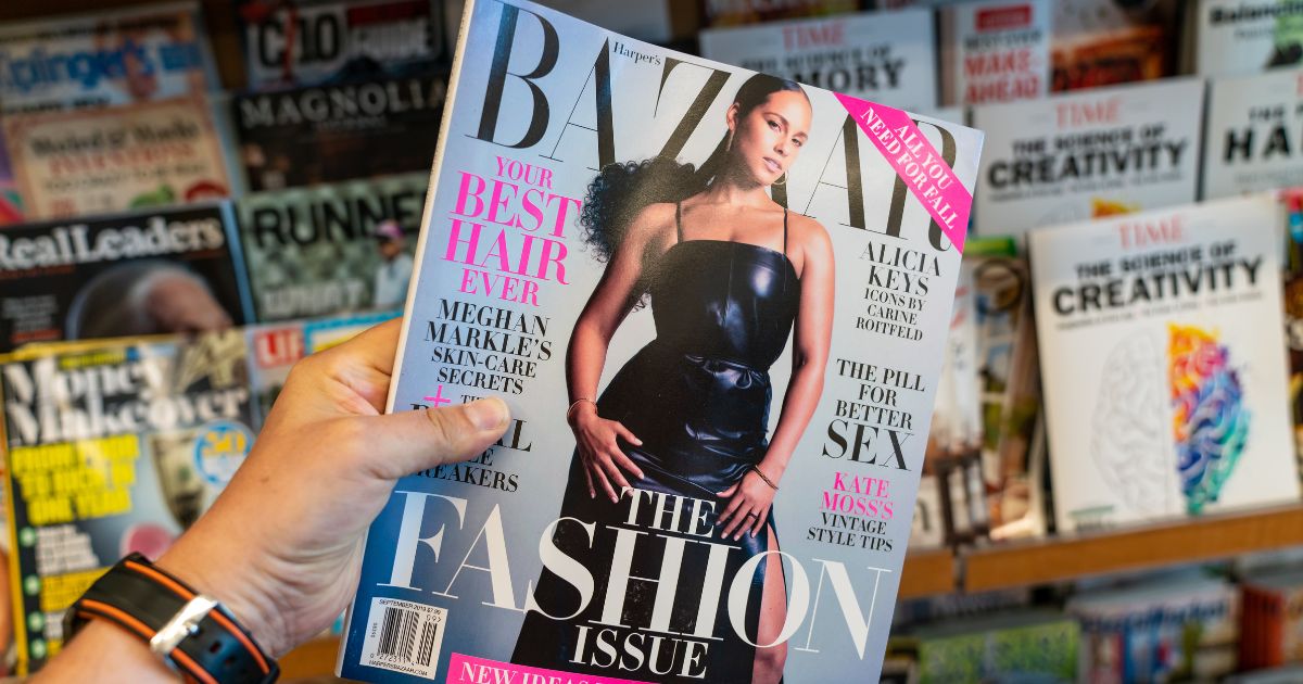 A stock photo from August 2019 shows a person holding a copy of Harper's Bazaar magazine at a news stand in San Francisco.