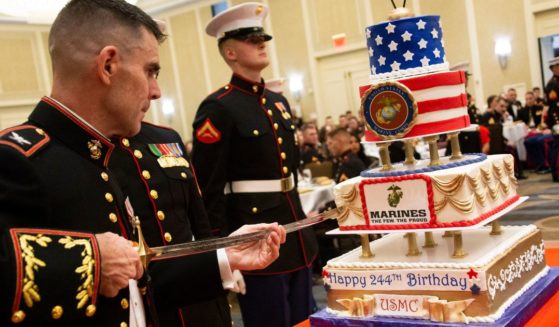 A Marine cuts the cake with a sword during a celebration of the Marine Corps' 244th birthday in Alexandria, Virginia, on Nov. 2, 2019.