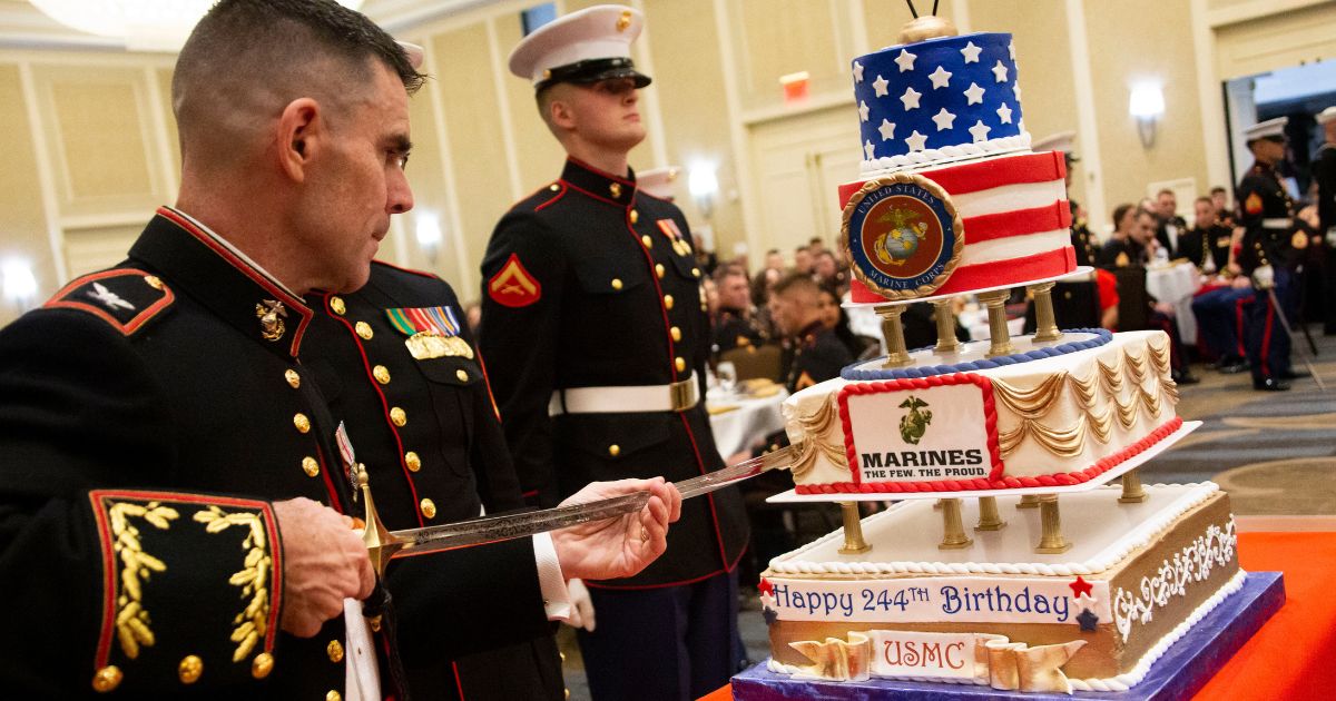 A Marine cuts the cake with a sword during a celebration of the Marine Corps' 244th birthday in Alexandria, Virginia, on Nov. 2, 2019.