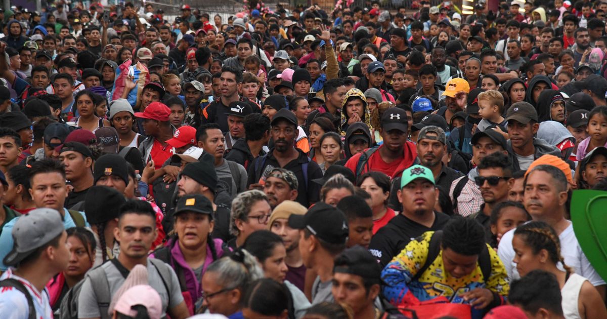 Hundreds of migrants march in a caravan towards the United States border through Tapachila, Chiapas State, Mexico, on Oct. 30.