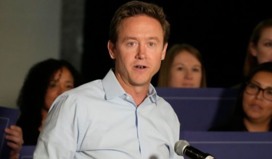Mike Johnston makes a point during a news conference to launch a campaign for an affordable housing measure on the November general election ballot on Sept. 13, 2022, in Aurora, Colorado. Now mayor of Denver, Johnston has had his vehicle stolen twice.