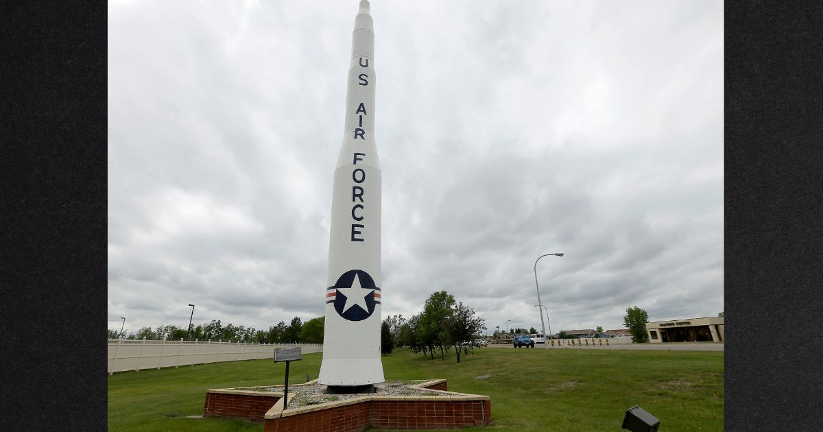 A retired Minuteman 1 missile stands at the main entrance to Minot Air Force Base, North Dakota, in a 2014 file photo. The base is defending itself from claims of political bias after an unofficial message cautioning airmen to not attend a conservative political rally began circulating on social media.