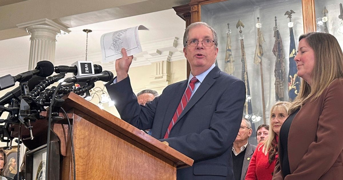 New Hampshire Secretary of State David Scanlan displays a sample ballot on Wednesday in Concord while announcing the date of the 2024 presidential primary.