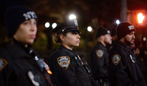 New York Police Department officers stand guard during a rally in the Brooklyn borough of New York City on Nov. 18.