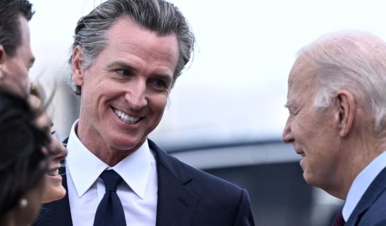California Gov. Gavin Newsom, left, greets President Joe Biden at San Francisco International Airport on Tuesday.