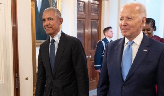 Former President Barack Obama, left, and President Joe Biden arrive at a ceremony to unveil the official Obama White House portraits at the White House in Washington on Sept. 7, 2022.