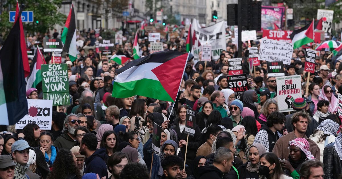 Protesters march during a pro-Palestinian protest in London, England, on Oct. 14. A man in London was recently arrested after posting a video on social media complaining about the number of Palestinian flags in his neighborhood.