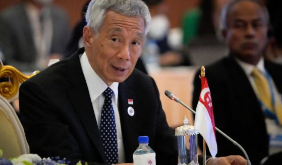 Singapore Prime Minister Lee Hsien Loong speaks during ASEAN - India Summits in Phnom Penh, Cambodia, Nov. 12, 2022. He said Sunday he plans to hand over power to his deputy, Lawrence Wong, late next year.