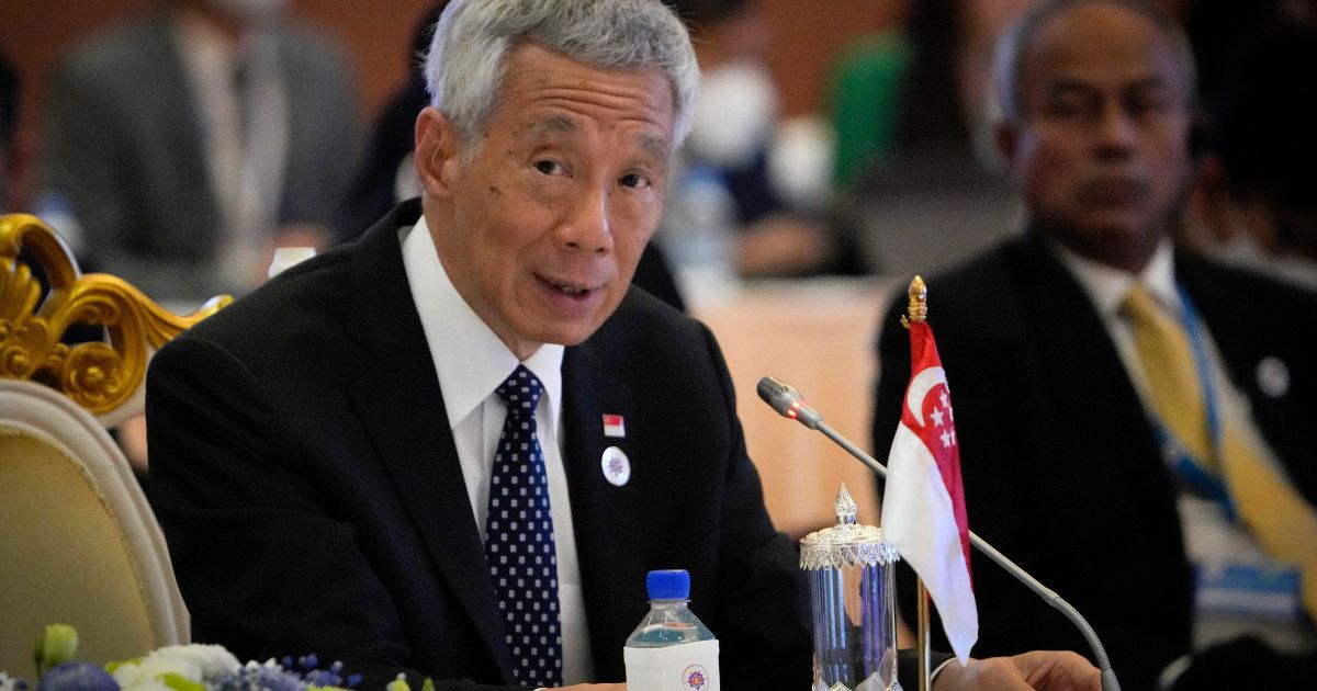 Singapore Prime Minister Lee Hsien Loong speaks during ASEAN - India Summits in Phnom Penh, Cambodia, Nov. 12, 2022. He said Sunday he plans to hand over power to his deputy, Lawrence Wong, late next year.
