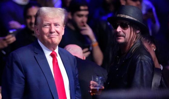 Former President Donald Trump, left, stands with Kid Rock at the UFC 295 mixed martial arts event in New York on Saturday.