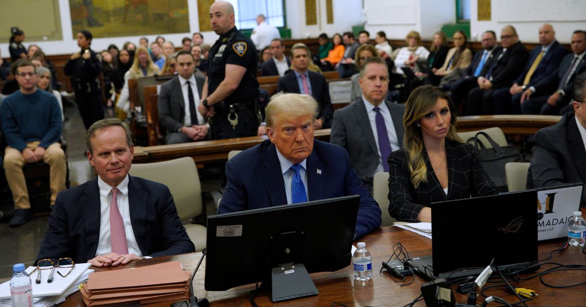 Former President Donald Trump sits in the courtroom with attorneys Christopher Kise, left, and Alina Habba during his civil fraud trial at New York State Supreme Court in New York City on Monday.