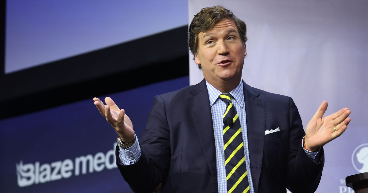 Tucker Carlson speaks to guests at the Family Leadership Summit in Des Moines, Iowa, on July 14, nearly three months after he was fired by Fox News.