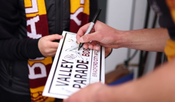 A Valley Parade sign is signed by a player before the Sky Bet League soccer playoff match between Bradford City and Carlisle United on May 14 in Bradford, England. Bradford is celebrating "multiculturism" this holiday season.