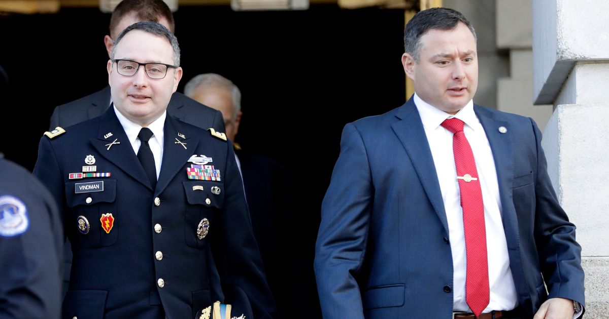 National Security Council aide Lt. Col. Alexander Vindman, left, walks with his twin brother, Army Lt. Col. Yevgeny Vindman, after testifying before the House Intelligence Committee on Capitol Hill in Washington, Nov. 19, 2019, during a public impeachment hearing of President Donald Trump's efforts to tie U.S. aid for Ukraine to investigations of his political opponents. Yevgeny "Eugene" Vindman has announced a run for Congress "to defend our nation against the clear and present danger of Donald Trump."