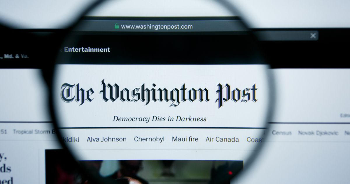 The homepage of the Washington Post website is displayed on a computer screen in this stock image.