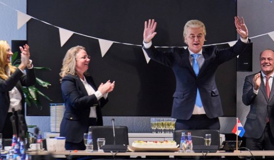 Party for Freedom leader Geert Wilders, second from right, celebrates with party members after winning the most votes in a general election at The Hague in the Netherlands on Thursday.
