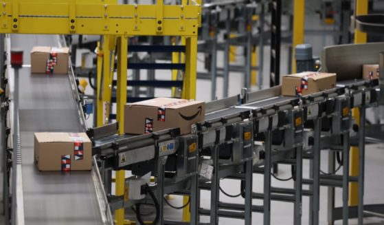 Packages move on a conveyor belt at an Amazon center in Rugeley, England, in a November 2022 file photo.