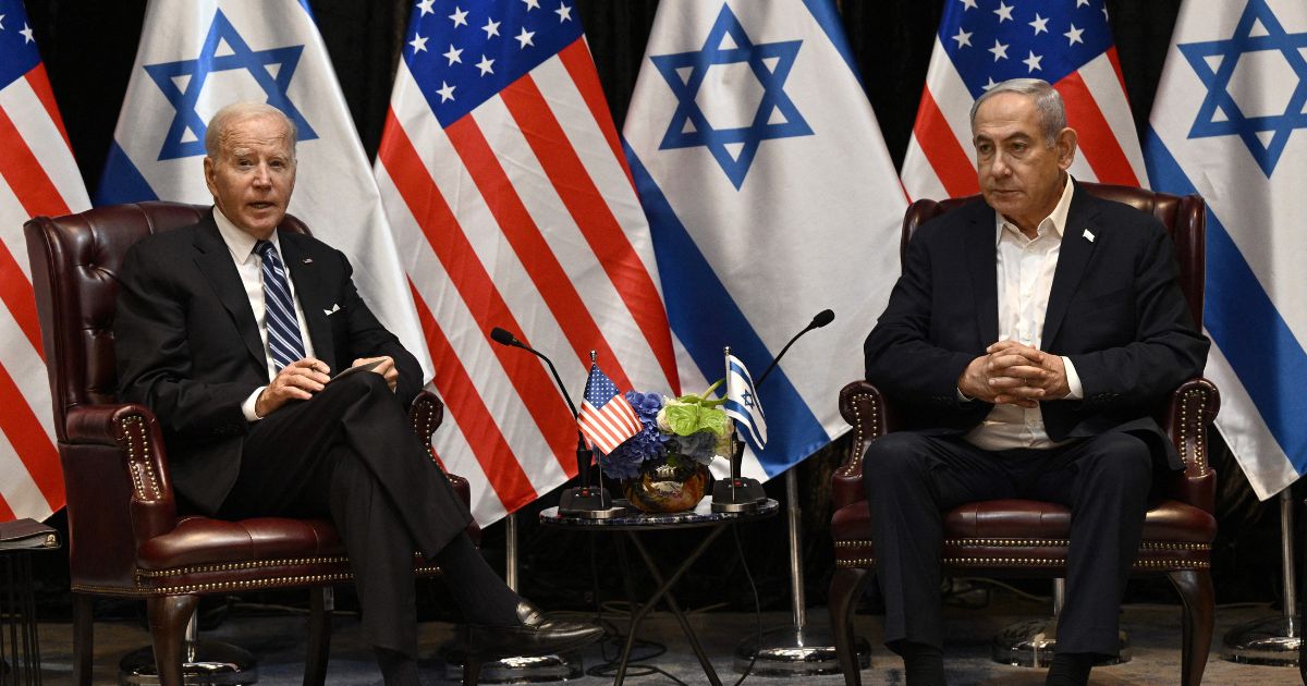 President Joe Biden, left, listens to Israel's Prime Minister Benjamin Netanyahu as he joins a meeting of the Israeli war cabinet in Tel Aviv on Oct. 18 amid the ongoing battles between Israel and the Palestinian group Hamas.