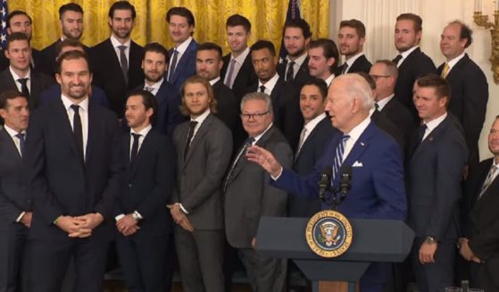 President Joe Biden talks to some clearly puzzled players for the Vegas Golden Knights NHL hockey team at the White House on Monday.