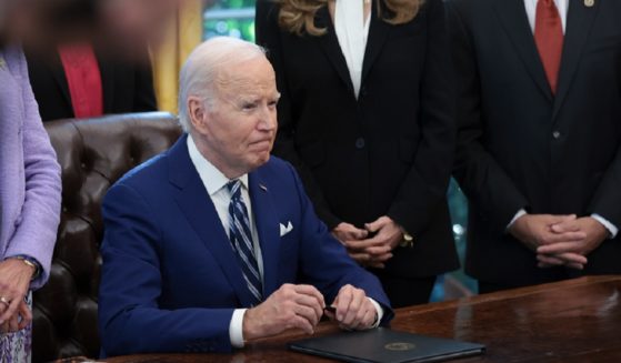 President Joe Biden takes questions at the White House on Monday during an Oval Office event.