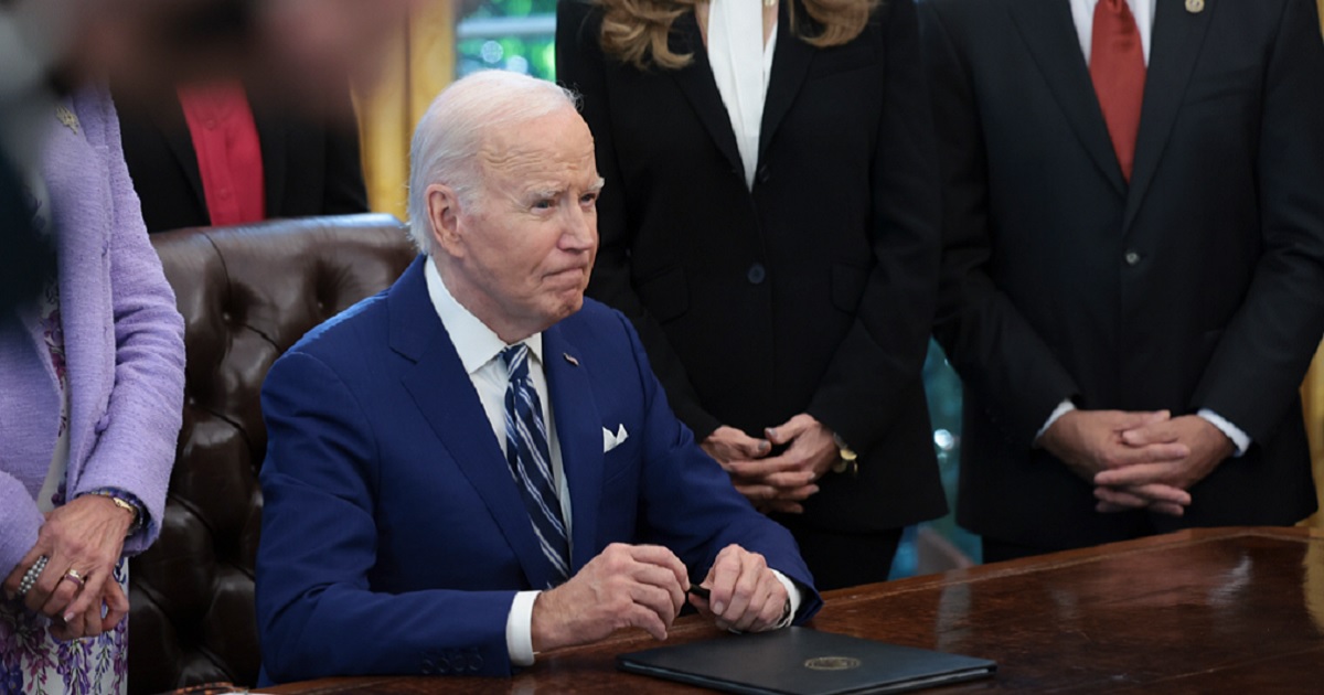 President Joe Biden takes questions at the White House on Monday during an Oval Office event.