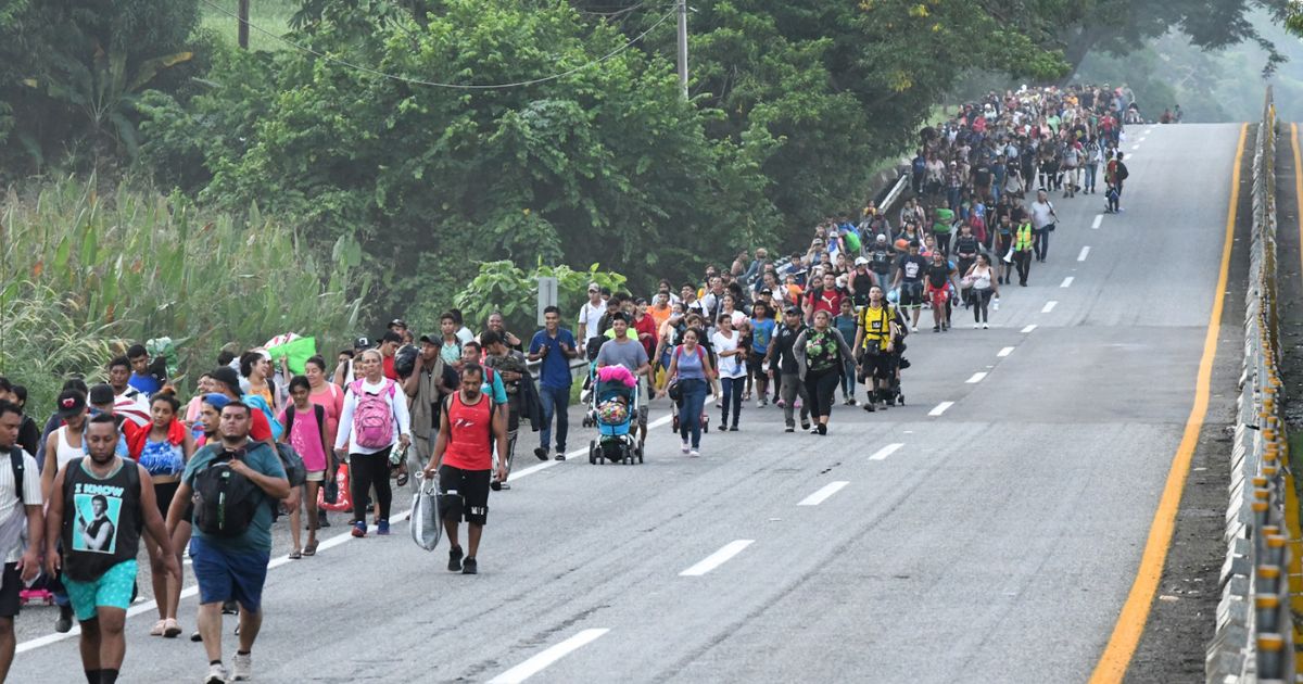 Migrants walk toward the border with the U.S. in Tapachula, Chiapas state, Mexico, on Tuesday.