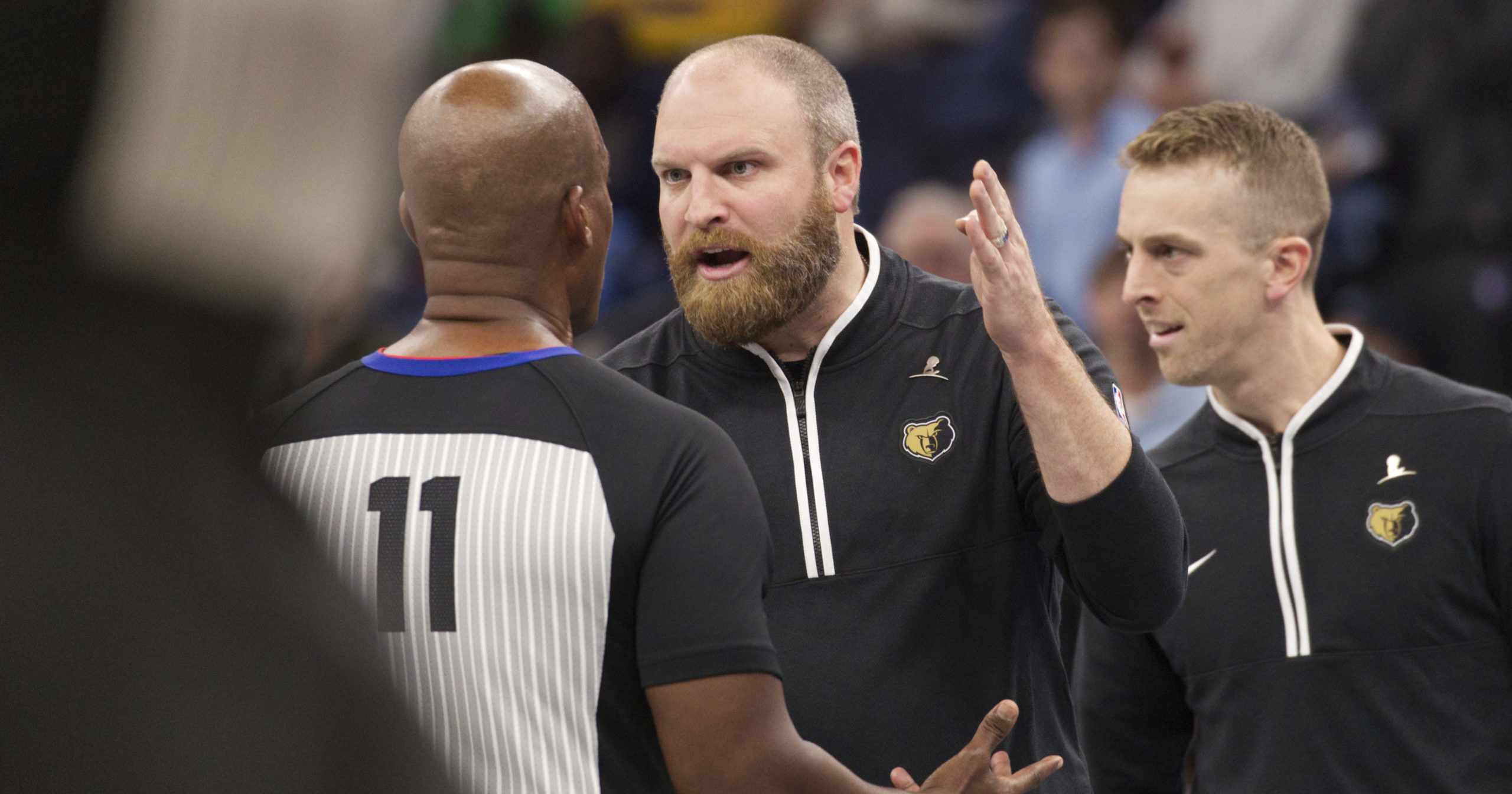 Memphis Grizzlies coach Taylor Jenkins argues with official Derrick Collins after the ejection of forward Jaren Jackson Jr. during the second half of the team’s NBA basketball in-season tournament game against the Utah Jazz on November 10, 2023, in Memphis, Tennessee.