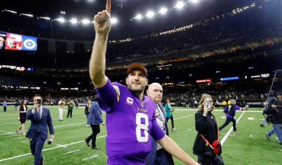 Kirk Cousins #8 of the Minnesota Vikings celebrates after defeating the New Orleans Saints 26-20 during overtime in the NFC Wild Card Playoff game at Mercedes Benz Superdome on Jan. 5, 2020, in New Orleans.