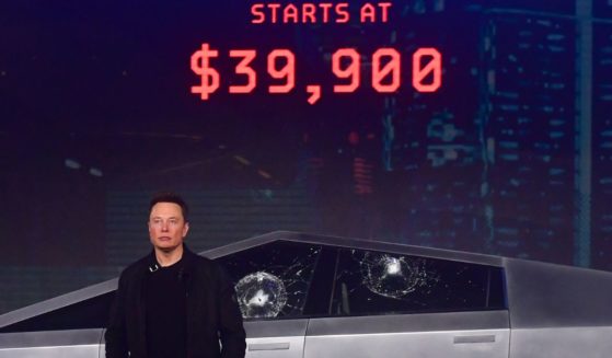 Tesla co-founder and CEO Elon Musk stands in front of the newly unveiled all-electric battery-powered Tesla's Cybertruck at Tesla Design Center in Hawthorne, California on November 21, 2019.