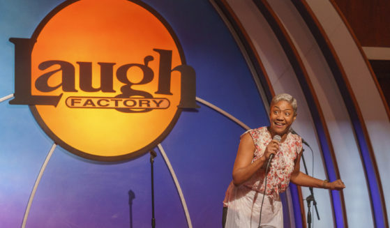 Stand-up comedian and actress Tiffany Haddish entertains guests at Laugh Factory Hollywood, during its free Thanksgiving Day meal Thursday in Los Angeles.