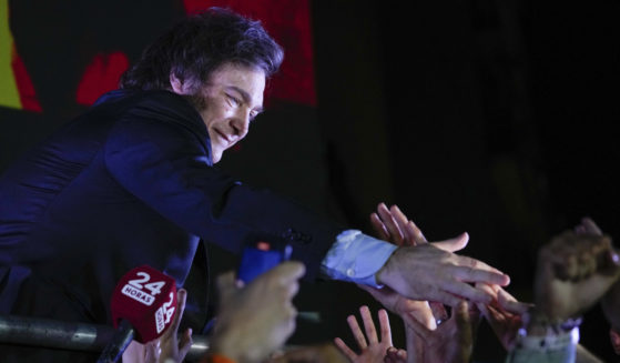 Javier Milei, presidential candidate of Argentina's Liberty Advances coalition greets supporters outside his campaign headquarters after winning the presidential runoff election in Buenos Aires on Sunday.