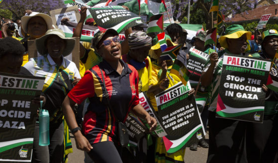 Pro-Palestinian supporters demonstrate at the entrance to the Israeli embassy in Pretoria, South Africa, on Oct. 20. On Monday South Africa withdrew its ambassador from Israel.