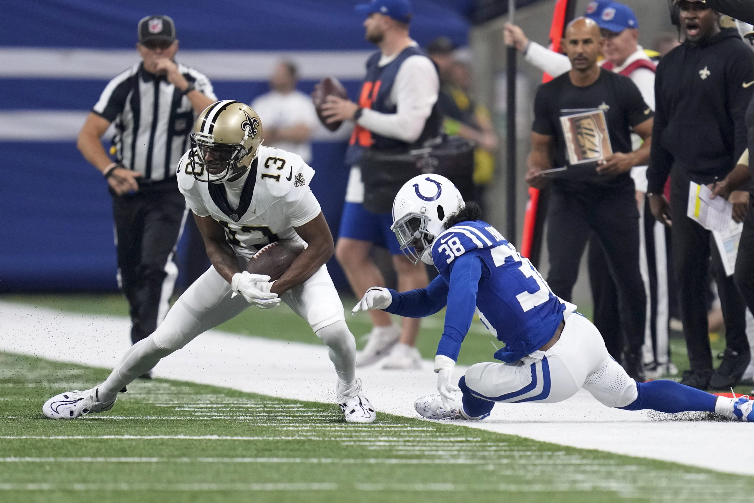 New Orleans Saints wide receiver Michael Thomas (13) sheds the tackle of Colts cornerback Tony Brown during the first half of an NFL game Oct. 29 in Indianapolis.