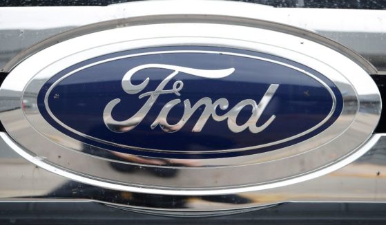 This Oct. 20, 2019, file photo shows the Ford company logo at a Ford dealership in Littleton, Colorado.