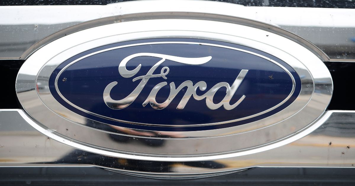 This Oct. 20, 2019, file photo shows the Ford company logo at a Ford dealership in Littleton, Colorado.