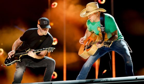 Country star Jason Aldean, right, with his band guitarist Kurt Allison, rocks the house in June during the CMA Fest 2023 at Nissan Stadium in Nashville.