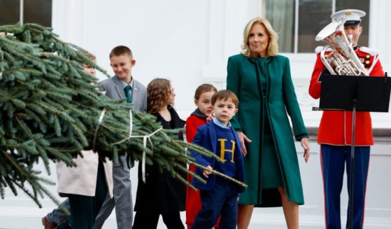 First lady Jill Biden oversees the arrival of the 2023 White House Christmas tree in Washington on Nov. 20 with children of military families.