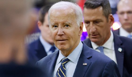 President Joe BIden is pictured among guests Nov. 6 at an event at an Amtrak facility in Bear, Delaware. At the event, Biden repeated an anecdote that has long been found to be impossible.