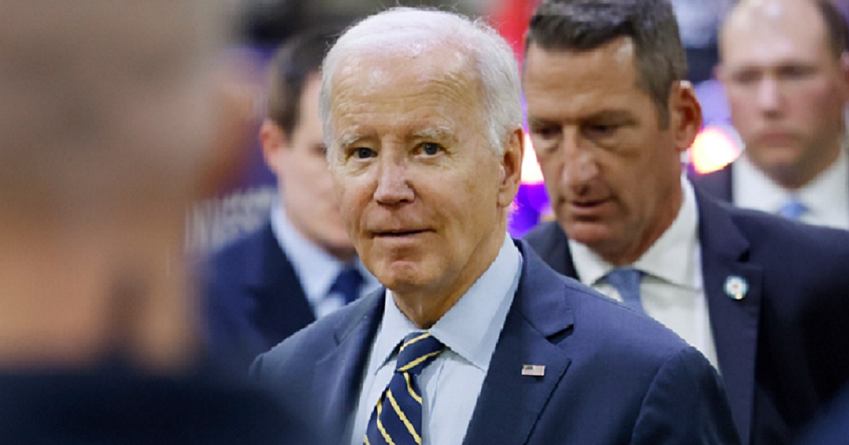 President Joe BIden is pictured among guests Nov. 6 at an event at an Amtrak facility in Bear, Delaware. At the event, Biden repeated an anecdote that has long been found to be impossible.