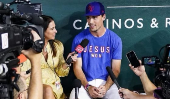 Texas Rangers left fielder Evan Carter is selling a T-shirt that says "Jesus Won."