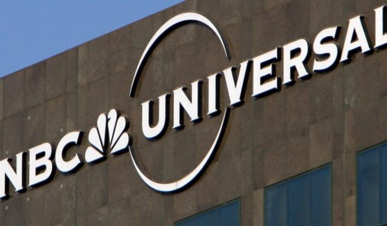 This Dec. 3, 2009, file photo, the NBC Universal logo hangs on a building in Los Angeles.