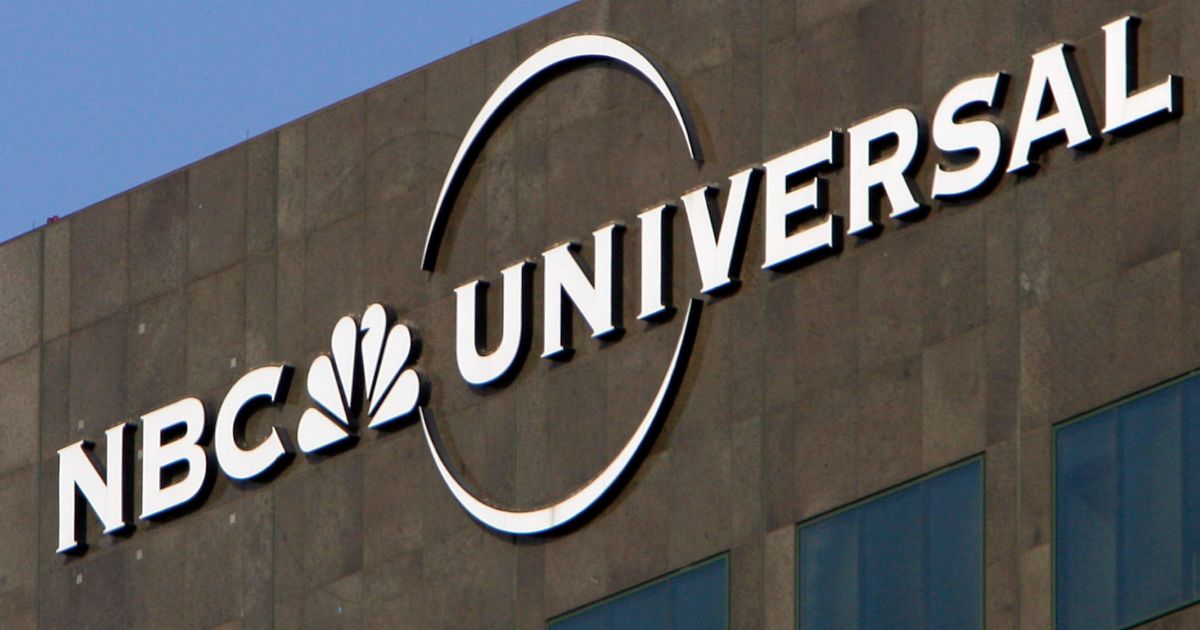 This Dec. 3, 2009, file photo, the NBC Universal logo hangs on a building in Los Angeles.