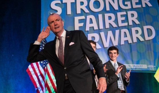 New Jersey Governor Phil Murphy gestures to supporters as he arrives to give a victory speech at Grand Arcade at the Pavilion on November 3, 2021 in Asbury Park, New Jersey.
