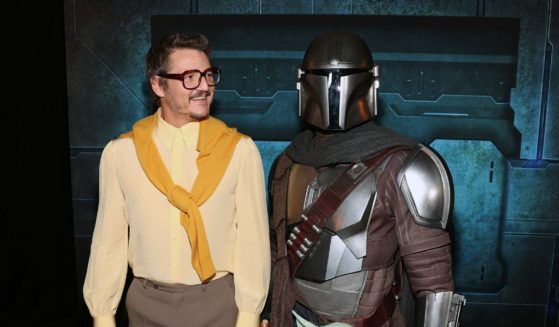 Pedro Pascal and a Disney Parks character attend the Mandalorian special launch event at El Capitan Theatre in Hollywood, California on February 28, 2023.
