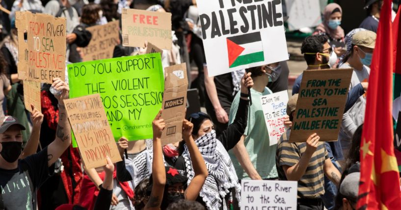Anti-Israel protesters hold signs in Los Angeles on May 15, 2021.