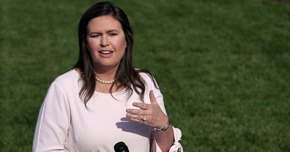 Then-White House press secretary Sarah Huckabee Sanders talks to reporters after an interview with FOX News outside the West Wing May 23, 2019, in Washington, D.C.